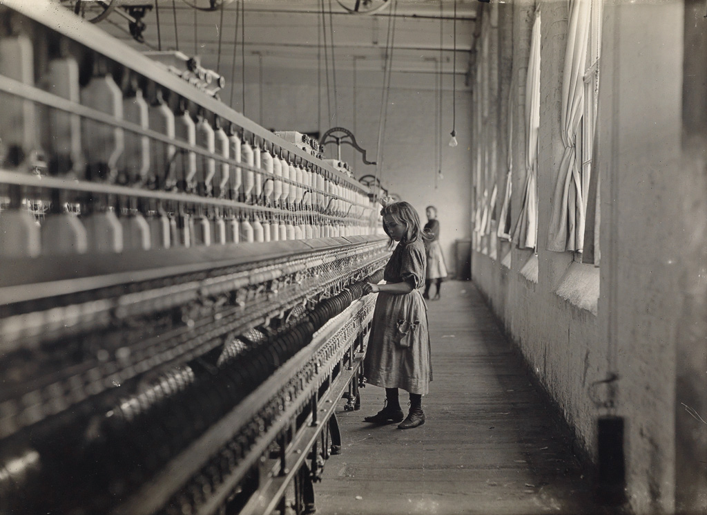 LEWIS W. HINE (1874-1940) One of many youngsters working in Carolina cotton mills.